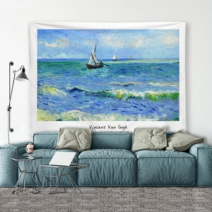 Artistic Vincent Van Gogh seascape tapestry hanging above a modern blue sofa for room decor