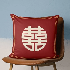 Detailed view of red velvet festive pillowcase with white double happiness symbol