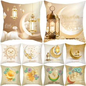 Close-up of ten square pillow covers with golden moon and lantern prints for Ramadan