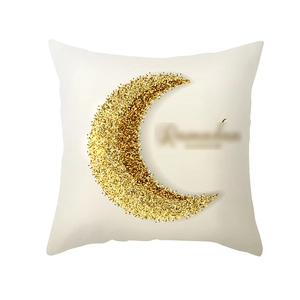 Detail of Ramadan cushion cover with golden glitter crescent moon and artistic lettering
