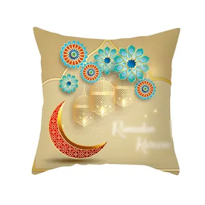 Detail of Ramadan pillow case featuring red moon, golden lanterns and floral patterns