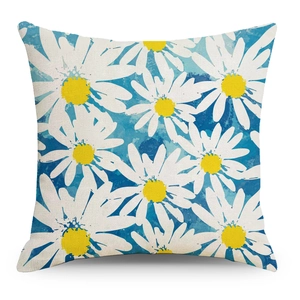 Linen pillowcase featuring daisy floral prints and blue watercolor texture on white