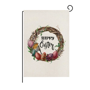 Close-up of Easter garden flag with bunny eggs and robin on a black metal stand