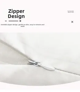 Detail showing the invisible zipper design on a marble print peach skin pillowcase