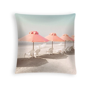 Detailed beach scene print on peach skin pillowcase with pink umbrellas and beach chairs