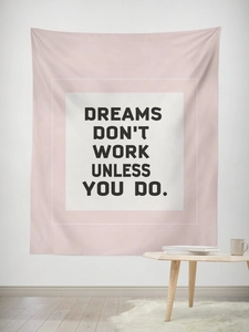 Detail of pink wall tapestry with inspirational typography in a minimalist interior setup