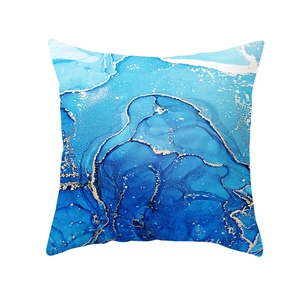 Detailed view of peach skin pillowcase with blue marble and gold ink art pattern