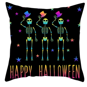 Detail of black Halloween pillowcase with dancing skeletons and Happy Halloween text