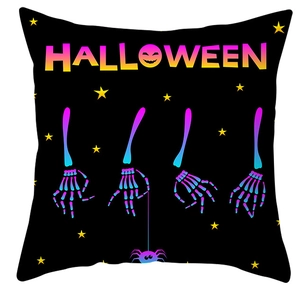 Detail of Halloween pillowcase featuring colorful skull hands and artistic typography