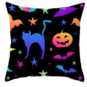 Detail of Halloween pillowcase featuring neon cat, pumpkin, and bat print patterns