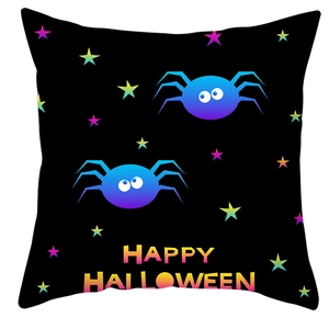 Detail of Happy Halloween pillowcase with colorful spider print on black fabric
