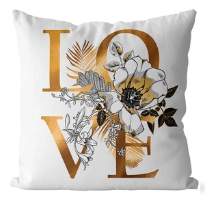 Detail of white pillowcase showing golden LOVE text and floral ginkgo leaf printing