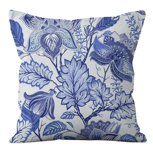 Detailed close-up of blue floral porcelain pattern on soft square pillowcase fabric