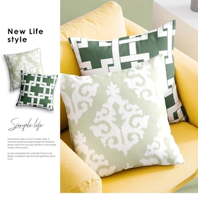 Detailed texture of green geometric and damascus pillow covers on a yellow sofa