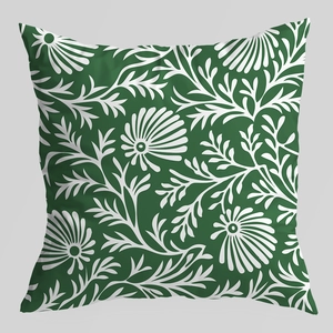 Luxury green pillow cover with white floral pattern on a minimalist grey background