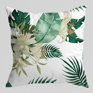 Detailed view of the watercolor tropical leaf and white lily floral cushion cover