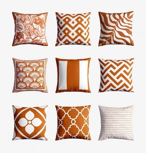 Collection of nine luxury orange and white square pillow covers with various geometric patterns