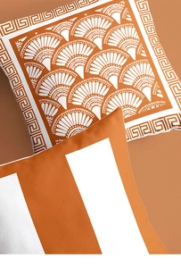 Detail of orange and white fabric with Greek key pattern and decorative stripes