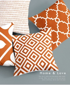 Macro detail of geometric orange and white cushion covers with textured cotton fabric