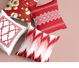 Detail of four red geometric print cushion covers with traditional floral patterns