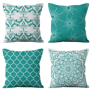 Set of four teal and white geometric print throw pillow covers with varied patterns