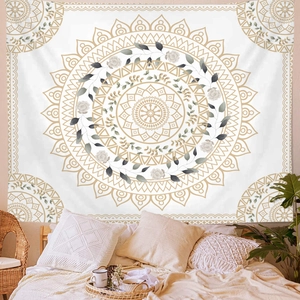 Bohemian mandala wall tapestry with golden patterns and white roses in a cozy bedroom