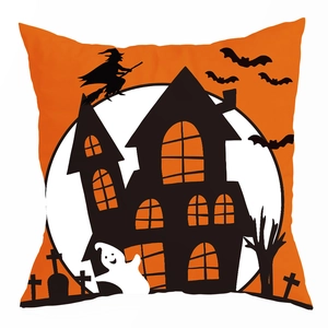 Detail of Halloween pillowcase with witch silhouette, bats, and orange moon on white fabric