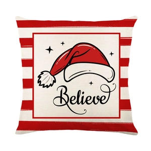 Christmas pillow cover with red stripes and Believe text with a Santa hat illustration