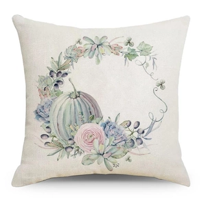 Detail of linen pillowcase featuring watercolor pumpkin and succulent floral wreath