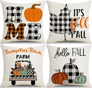 Close-up of four Thanksgiving pillow covers with pumpkin, truck and maple leaf patterns