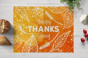Detail of Thanksgiving placemat with Happy Thanksgiving print on cotton linen fabric