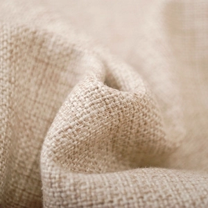 Close-up of beige linen Frankenstein Halloween pillow cover with natural woven texture