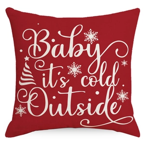 Red Christmas pillow case with Baby It's Cold Outside text and snowflake patterns