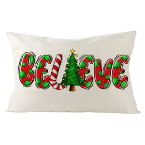 Detail of linen Christmas lumbar pillow with BELIEVE print and festive tree patterns