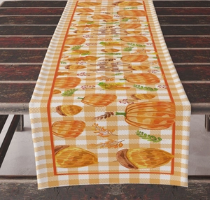Macro view of Thanksgiving table runner featuring pumpkin and maple leaf prints