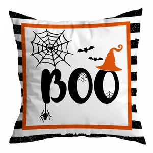 Close-up of Halloween peach skin pillow cover with BOO text and orange wizard hat print