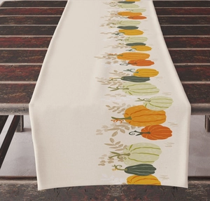 Detailed texture of autumn pumpkin table runner on vintage dark wood tabletop