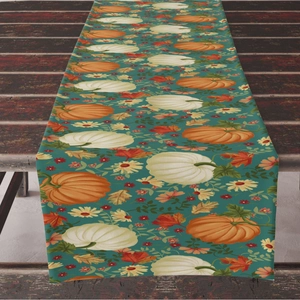 Fall table runner with pumpkin and maple leaf print on dark wood grain background