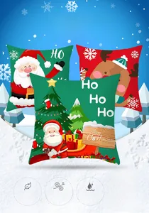 Detail of Christmas pillowcase featuring Santa, reindeer, and tree prints in red and green