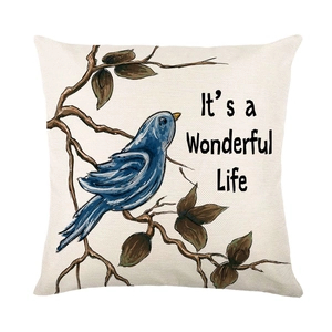 Weihnachtlicher Kissenbezug aus Leinen mit blauem Vogel und dekorativem Schriftzug