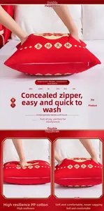 Detail view of red Chinese wedding pillow with gold Xi character and hidden zipper