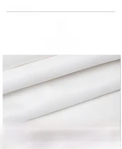 Macro detail of white soft plush fabric with skin-friendly texture and ribbed stripe design