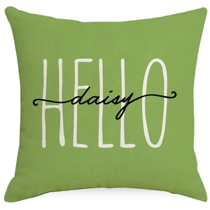 Green linen pillow cover with white HELLO daisy floral print on a white background