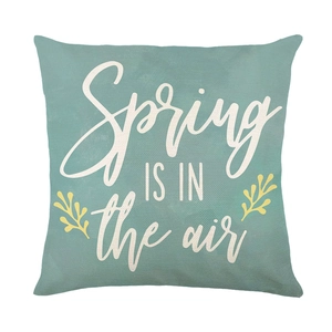 Green spring decorative pillow cover with Spring is in the Air text on linen fabric