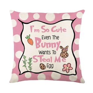 Pink polka dot Easter pillow case with cute bunny graphics and festive text printed on linen