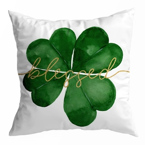 Macro shot of St. Patrick's Day peach skin pillowcase with green clover and gold blessed print