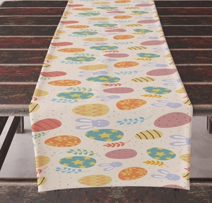 Detailed view of Easter table runner with colorful eggs and rabbits on vintage wood