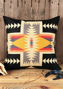 Ethnic tribal cushion cover with geometric cross pattern on rustic wooden background
