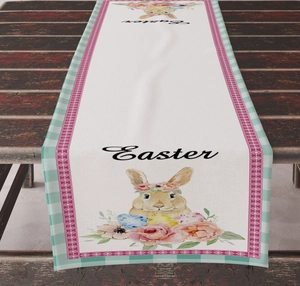 Detail of Easter table runner featuring cartoon rabbits and eggs on a dark wooden table