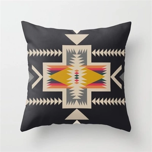 Close-up of linen pillow cover showing tribal geometric patterns and fabric texture